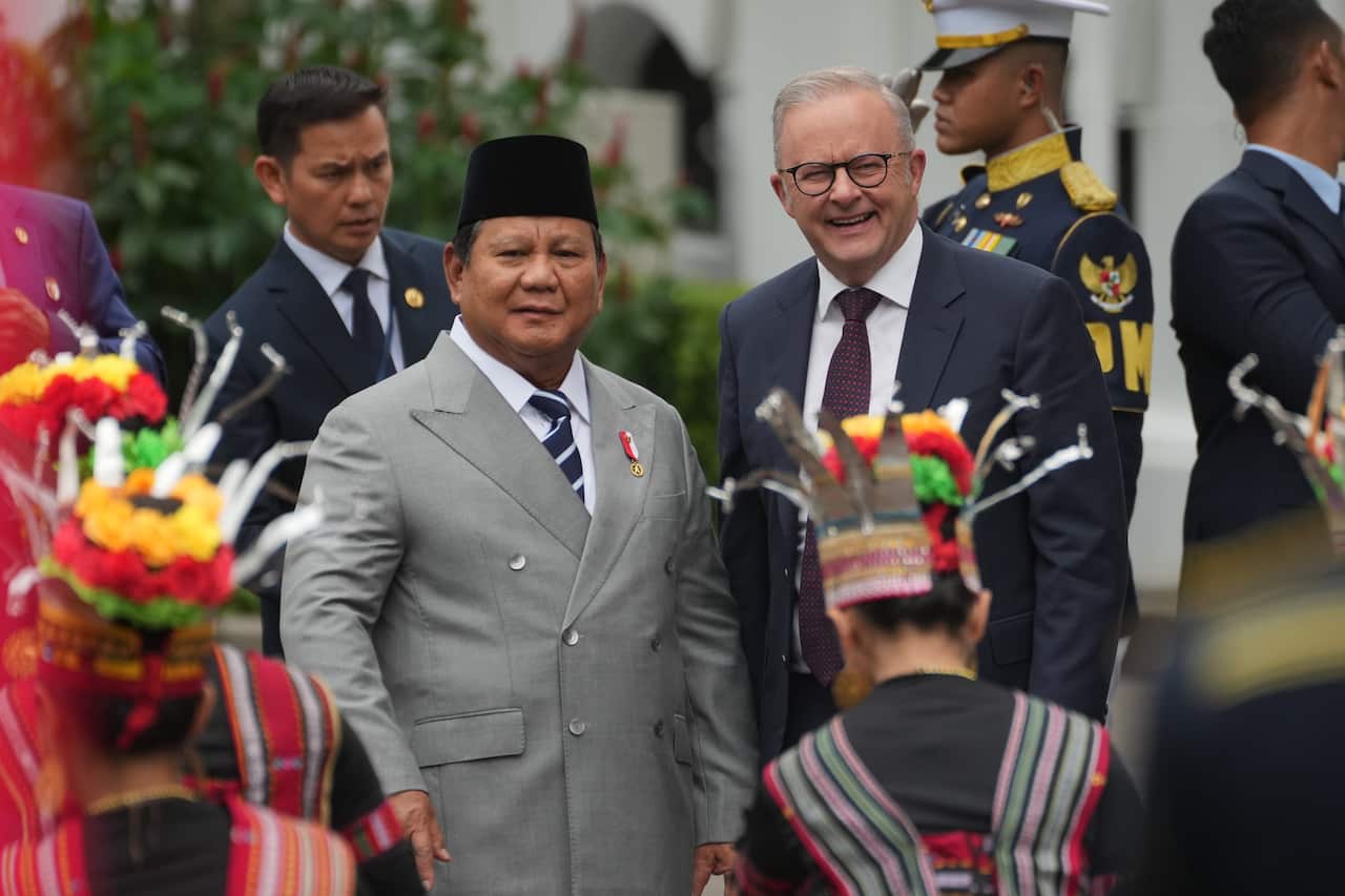 Prabowo Subianto and Anthony Albanese are smiling as they watch a traditional Indonesian dance performance.