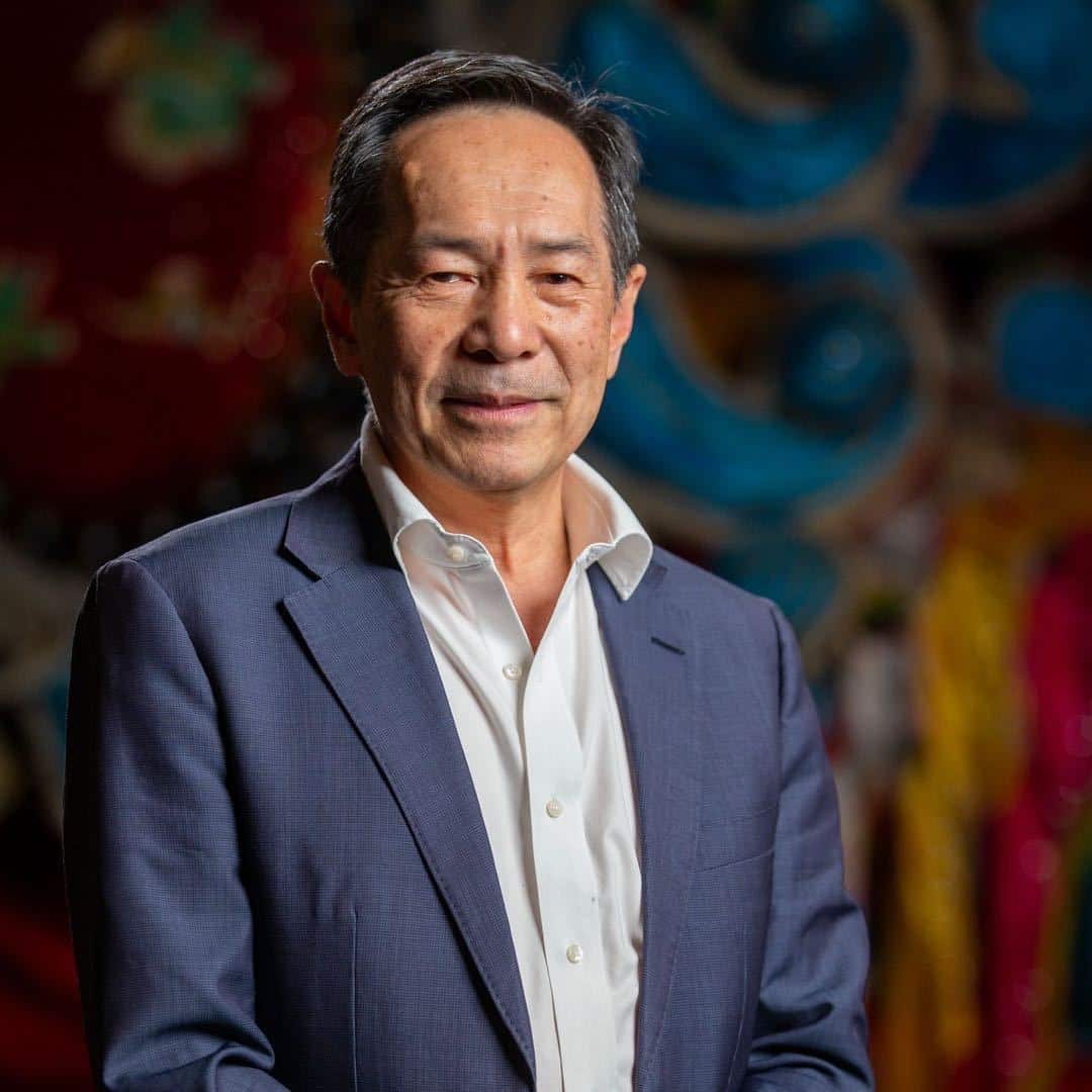 Man wearing a blue suit and white shirt