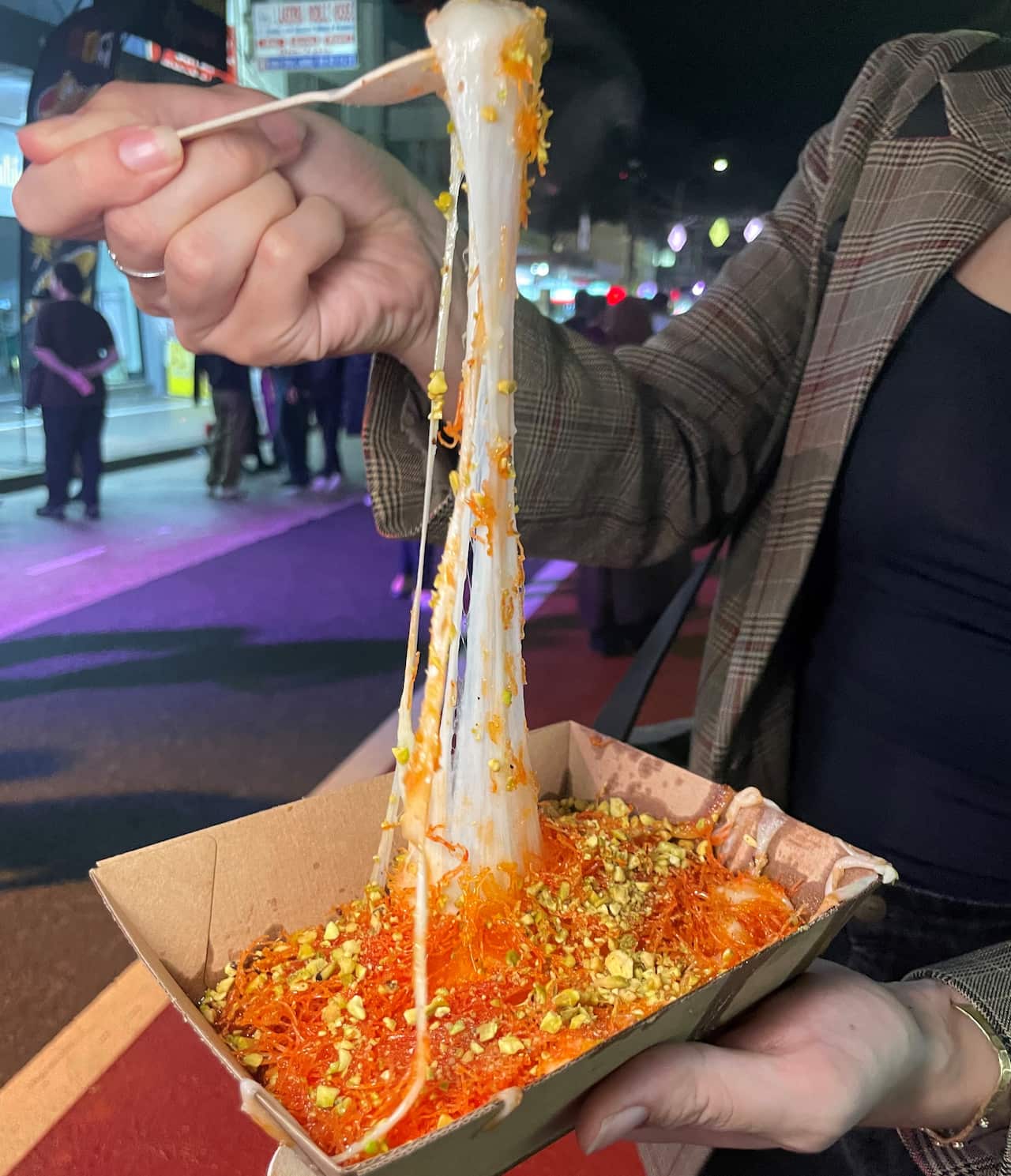 Knafeh is being stretched. 