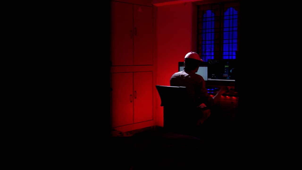 A person in front of the computer.