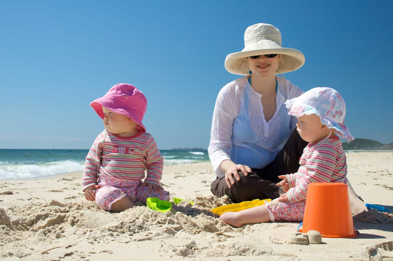 Mother and Twin Babies at the Beach