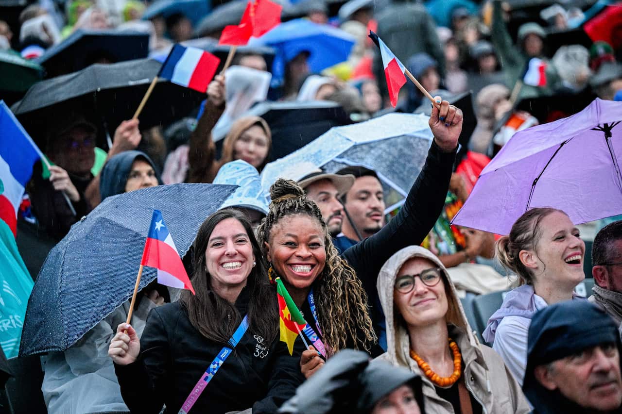 A group of people with umbrellas