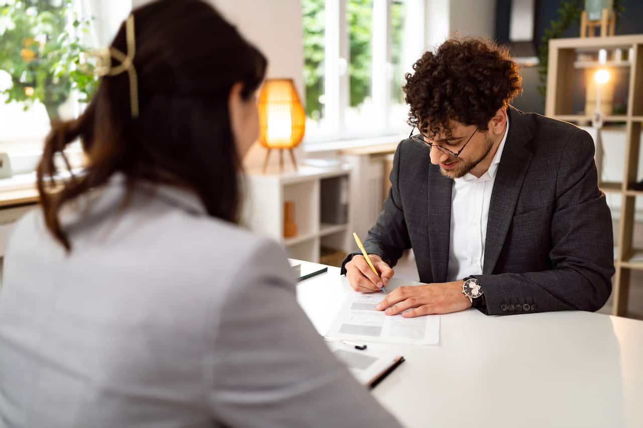 Male candidate signing the contract