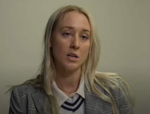 A woman with blonde hair wearing a blazer