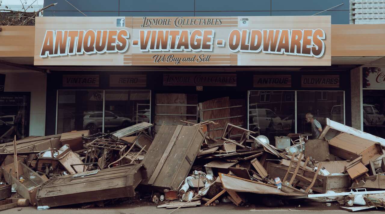 Debris is seen outside an antiques and oldwares store in Lismore. 