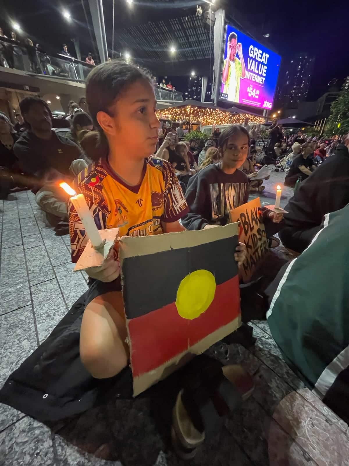 A young girl showing up for Cassius in Brisbane.