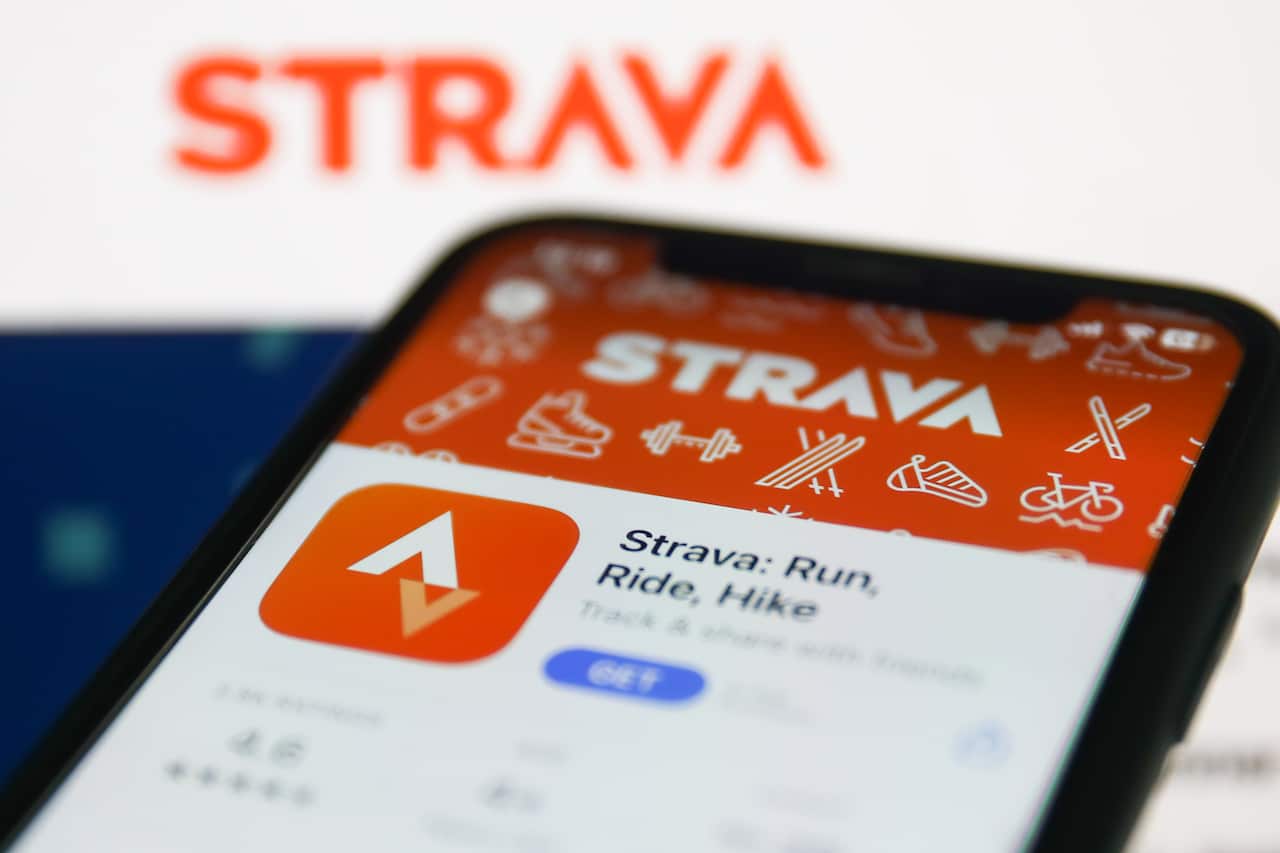 Phone showing Strava app.