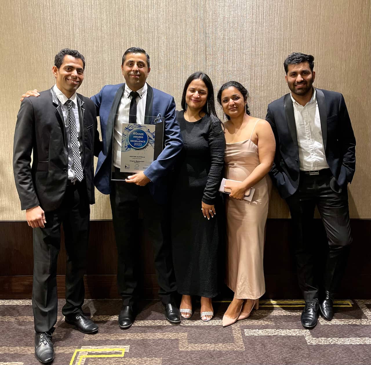 Chakra Restaurant owners and team member at the state awards. 