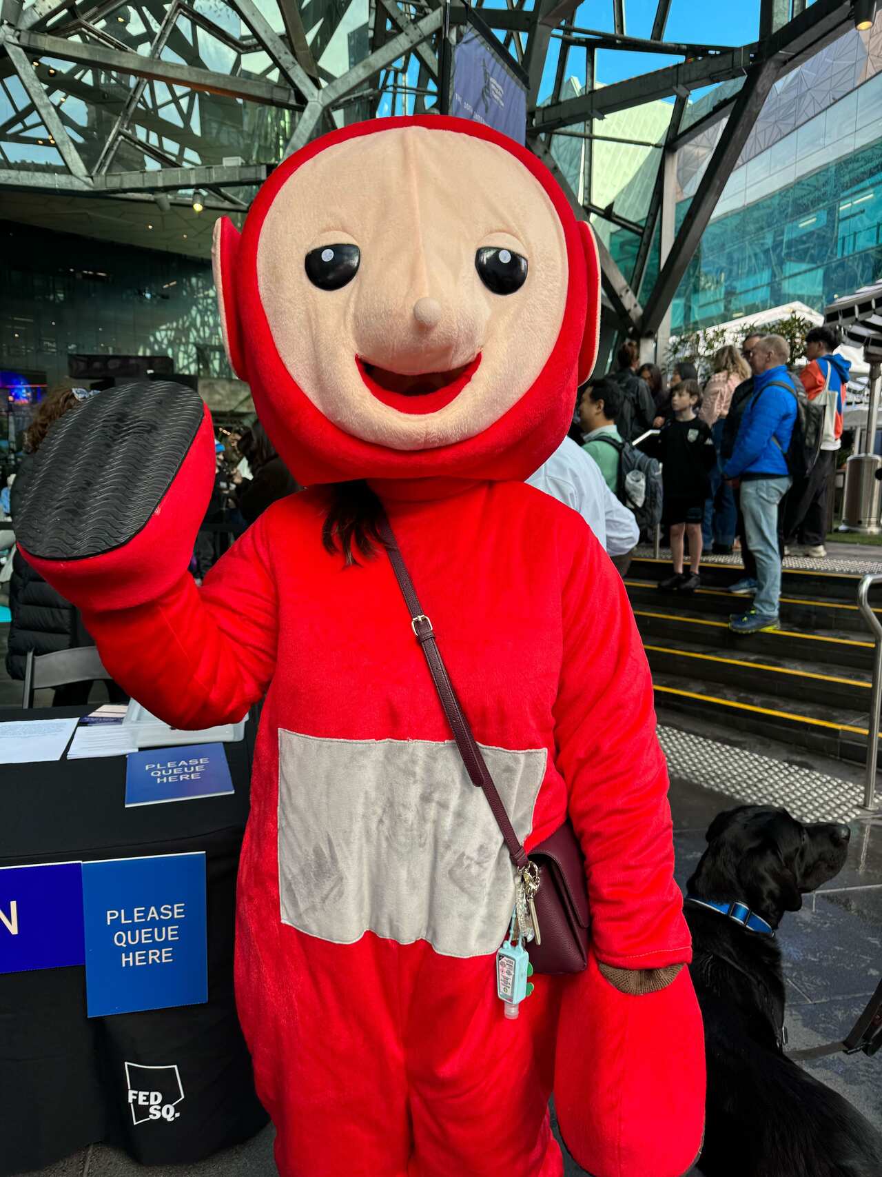 A person in a lifesize red Teletubbies costume