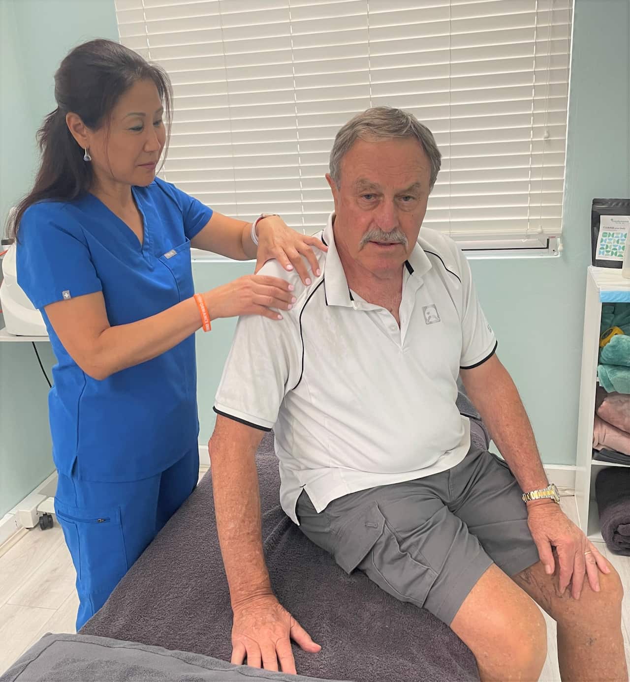 Helen Shao with John Newcombe, in her Sydney clinic.