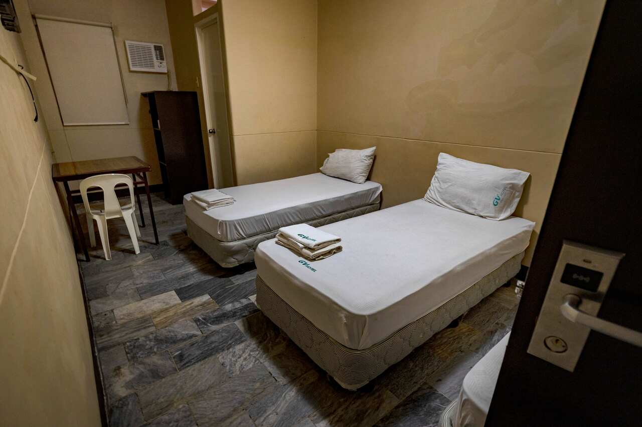 Two beds in a small room