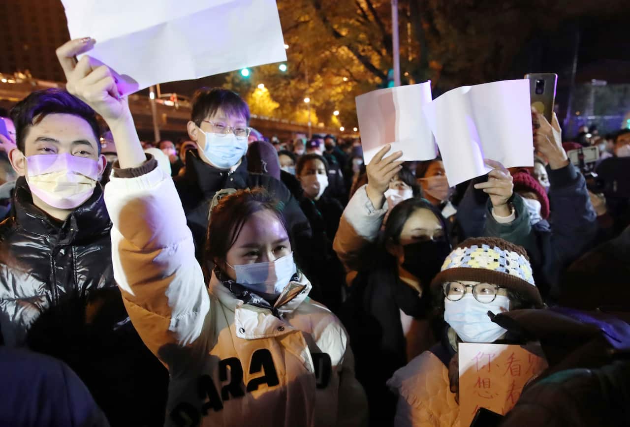 People held white paper to express their protest against Zero-Covid policy in Beijing on November 27, 2022. 