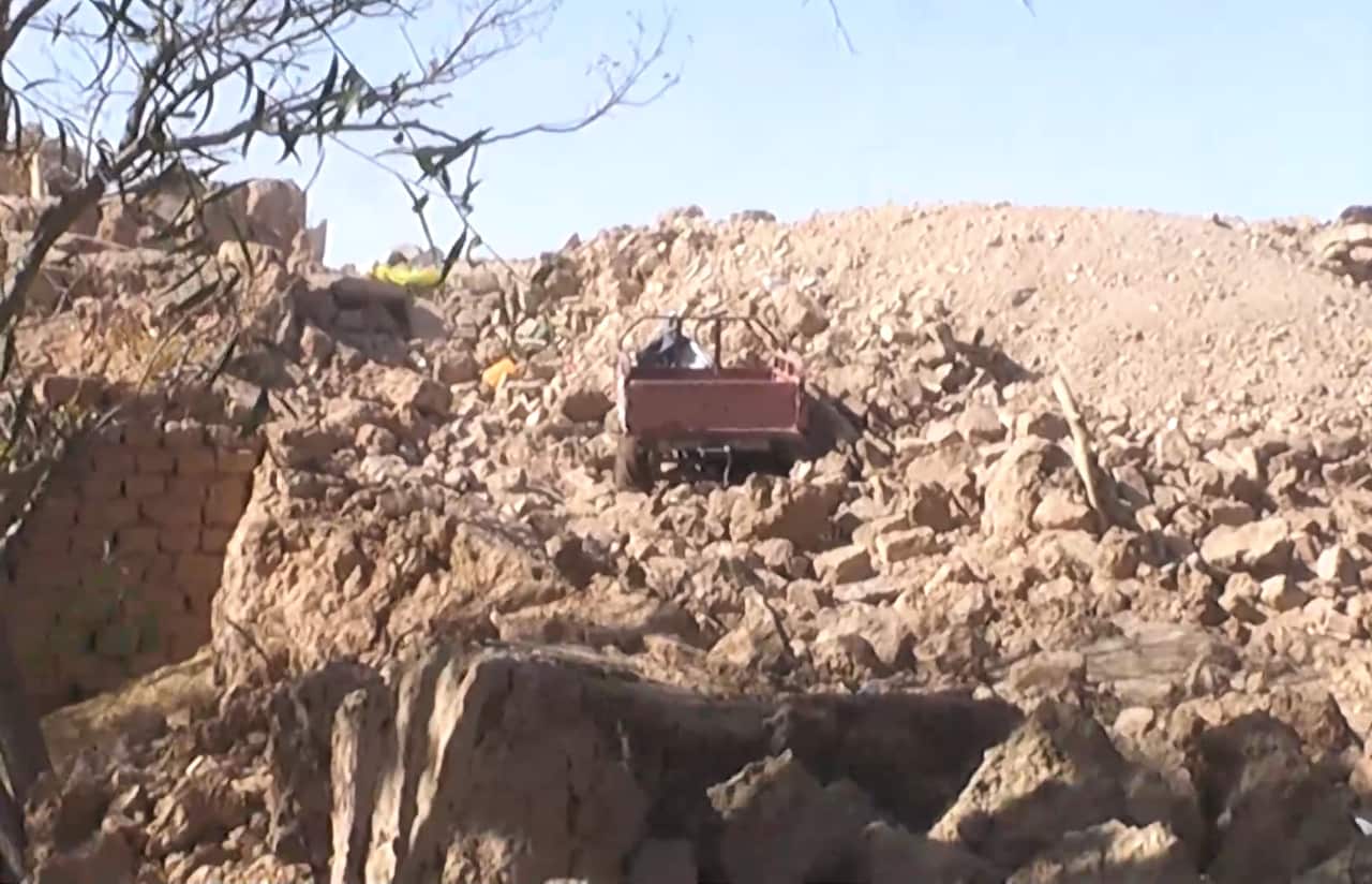 A bulldozer in rubble after earthquake damages Herat province, Afghanistan. 
