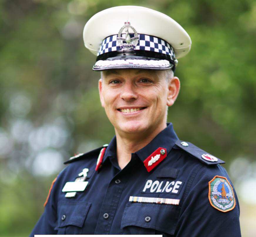 assistant police commissioner travis wurst in uniform smiles at the camera