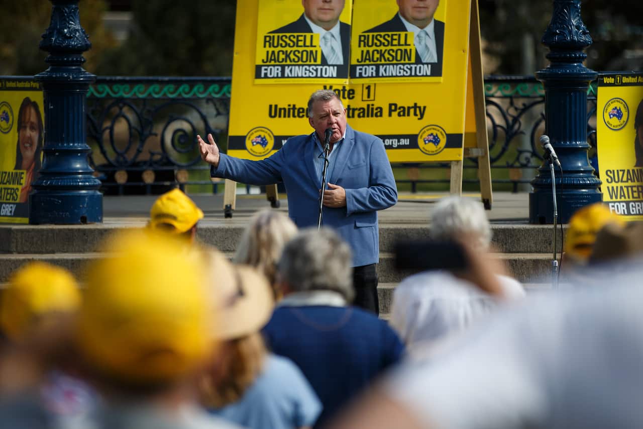 CRAIG KELLY standing making announcement to supporters