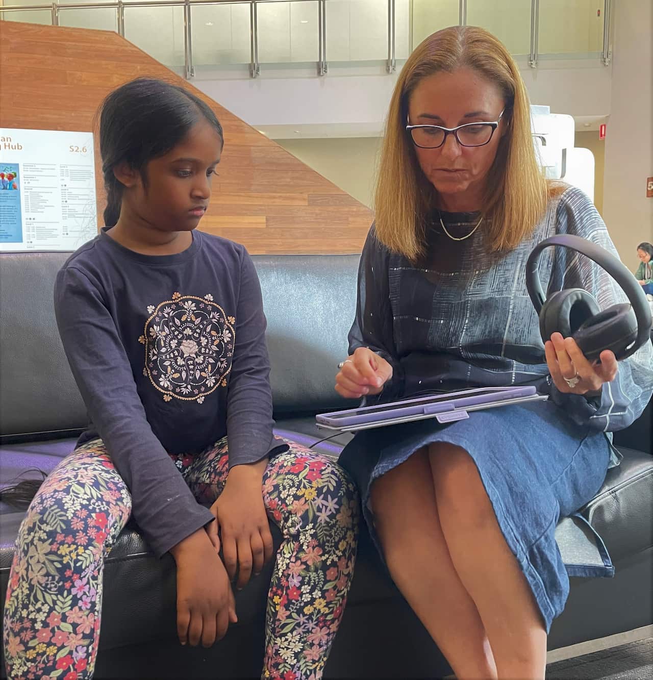 Carolyn Mee demonstrating Sound Scouts to Adelyn Naidoo.