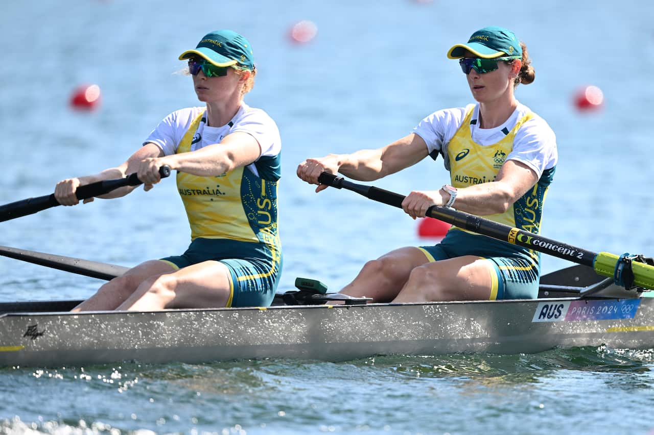 Two female rowers in Australian Olympic uniforms