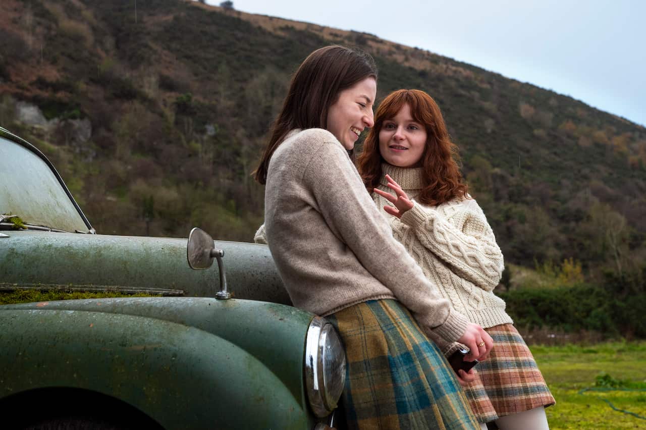 Hazel Doupe as Marian Price, Lola Petticrew as Dolours Price in 'Say Nothing'.