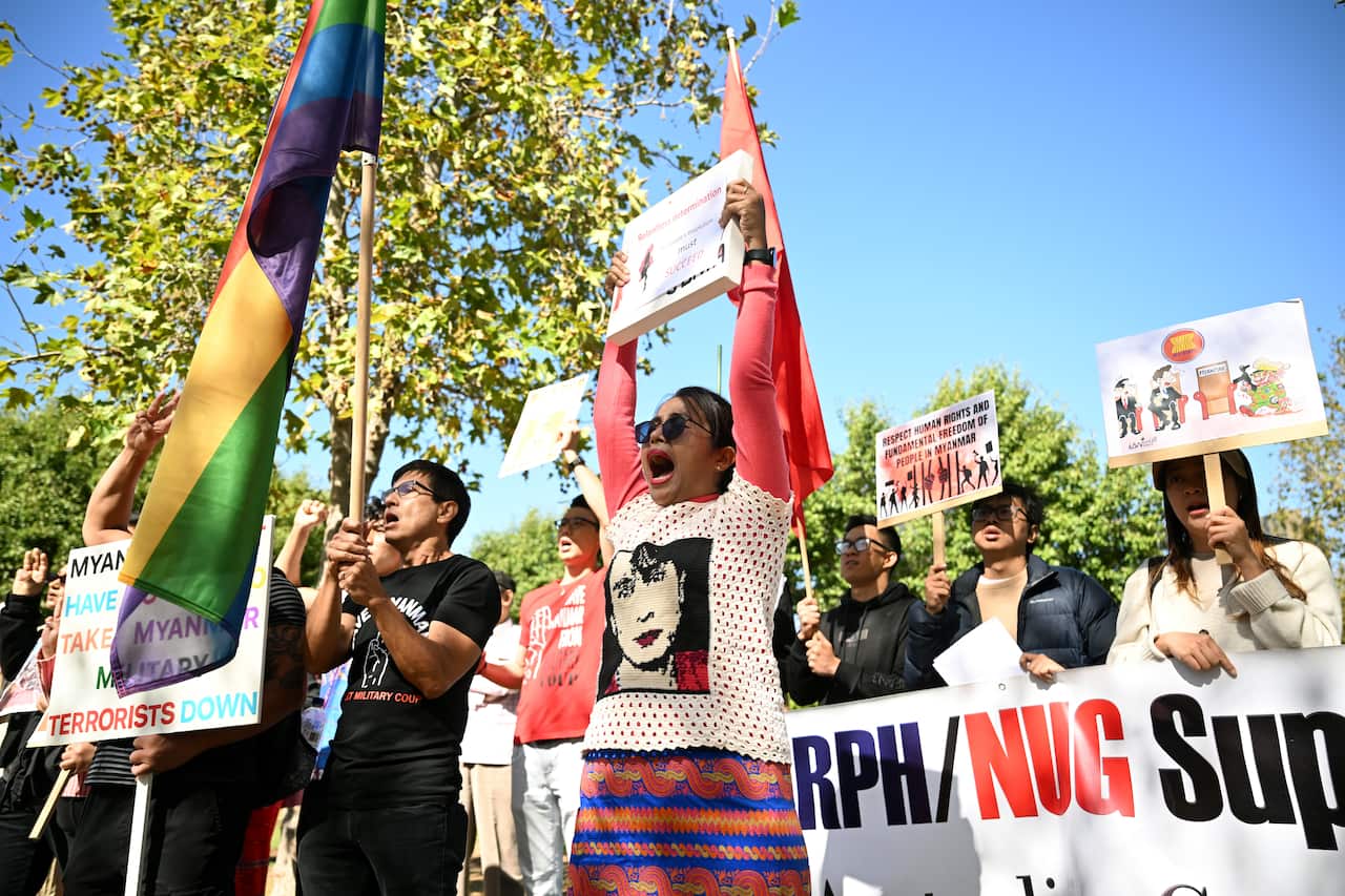 Protestors holding up signs
