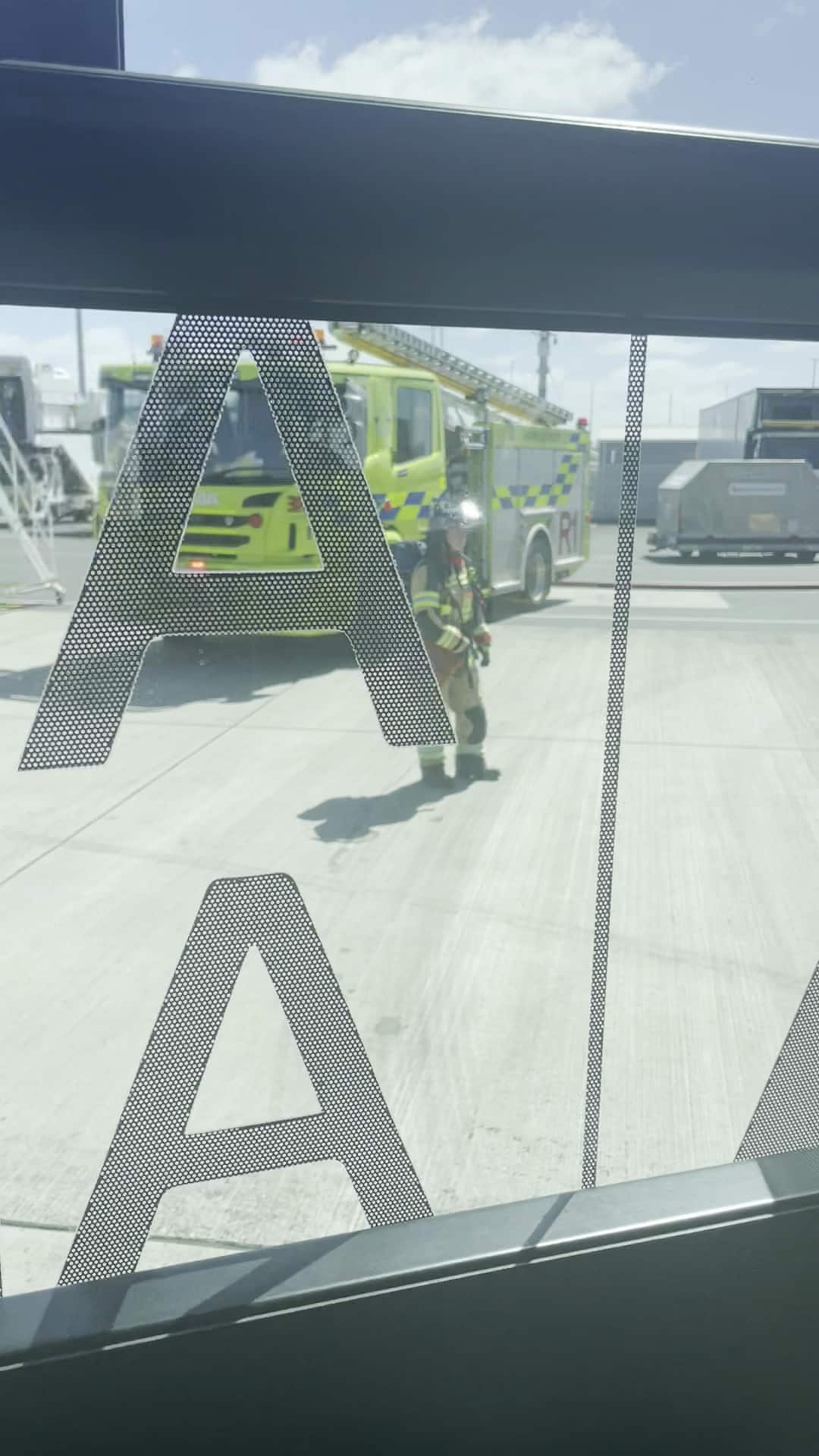 A fire truck outside an airport.