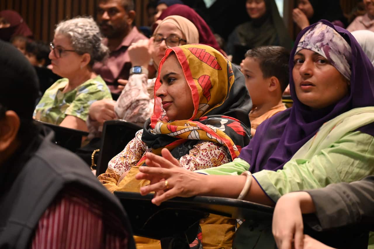 A group of people sitting at a graduation ceremony