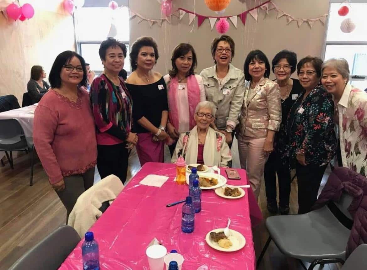 Ella with her sisters and friends at her mum's 100th birthday.jpg