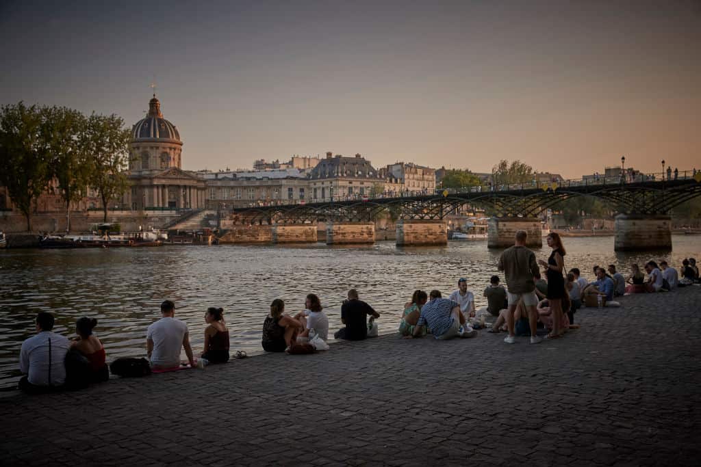 Parisians sit by the River Seine after a day of soaring temperatures of close to 40°C.