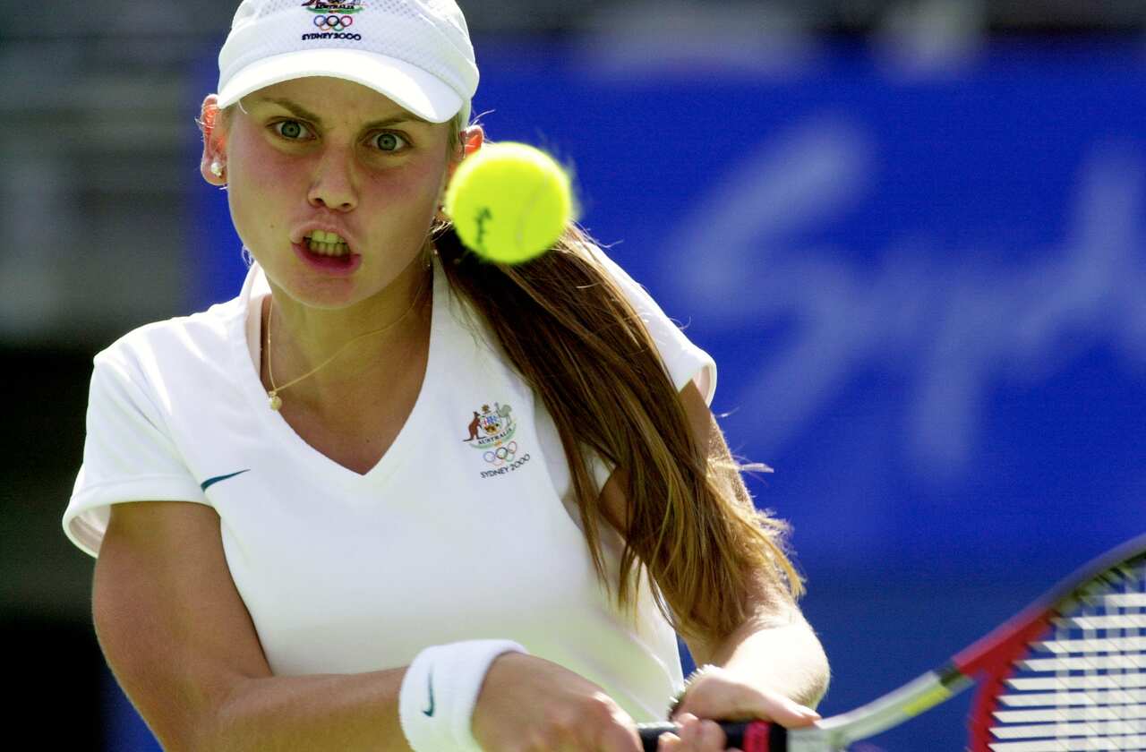 Jelena Dokic playing tennis