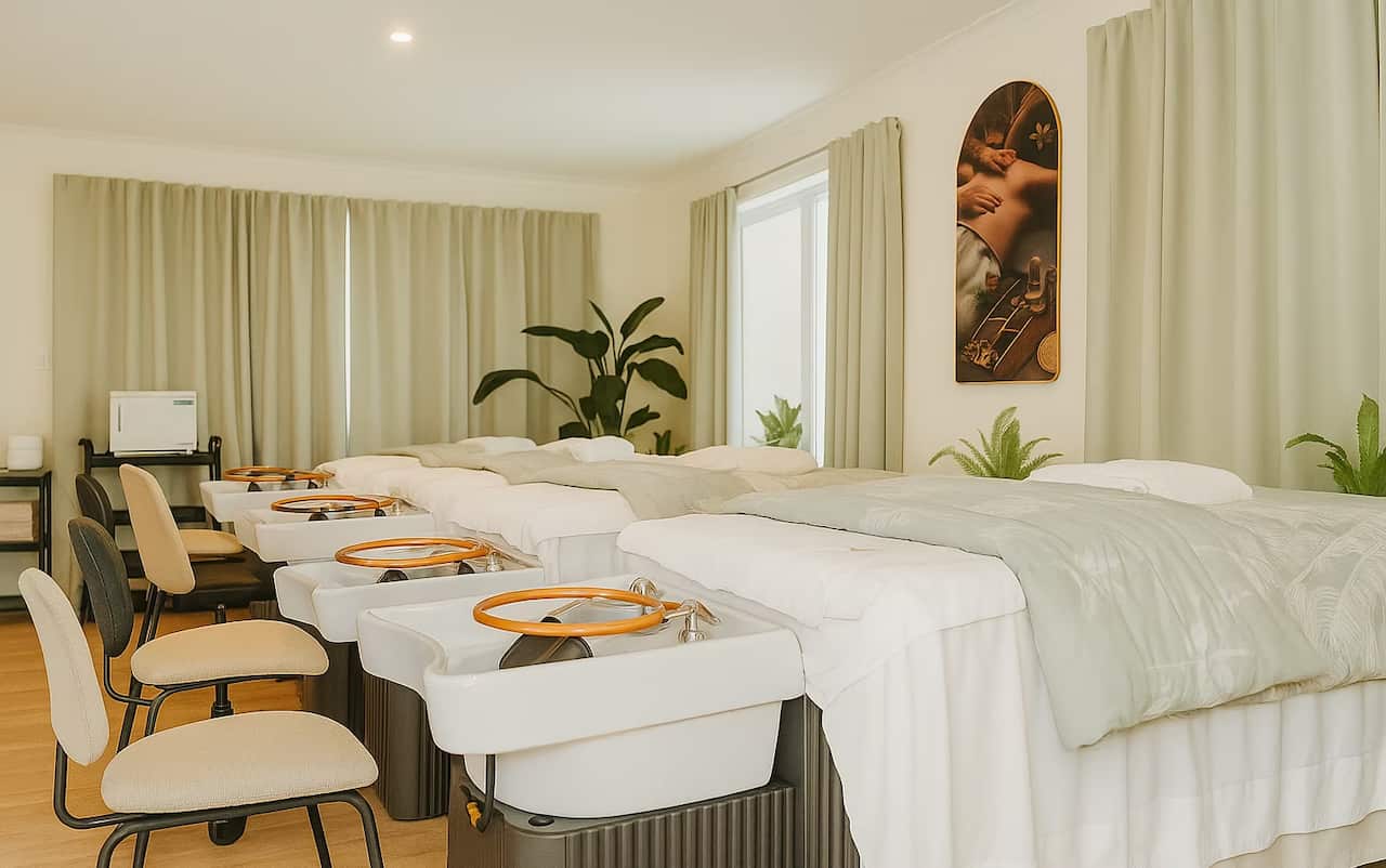 A wellness spa with massage beds and basins