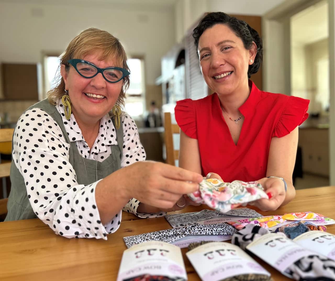 Migrant Women in Business co-founder Luz Restrepo sitting with Macarena Erbs.
