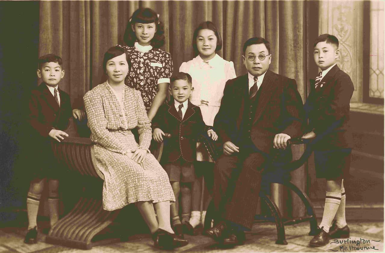 A family pose for a black and white photo