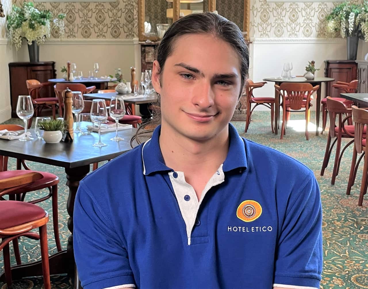 Intern Quinn Jones in the Hotel Etico dining room 