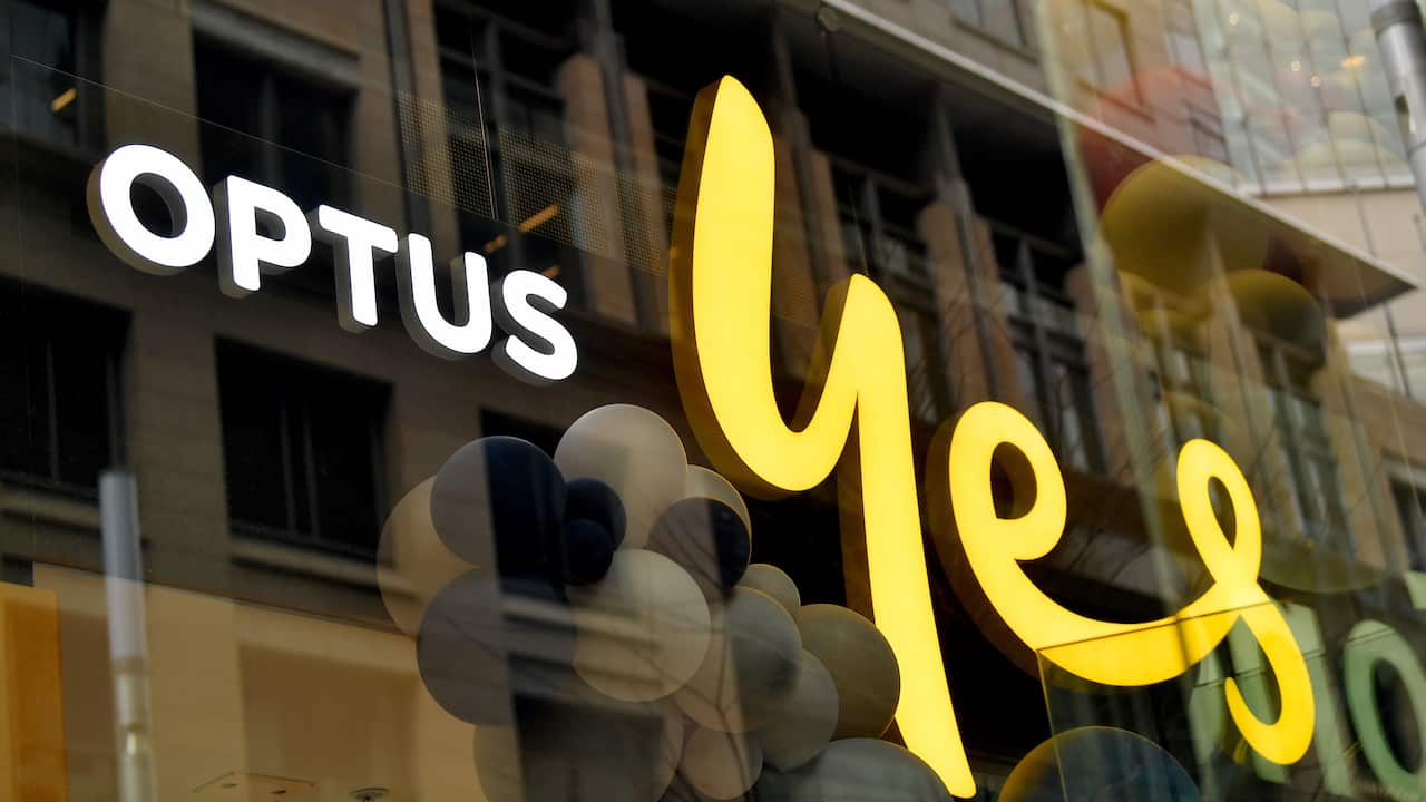 An Optus sign in a window.