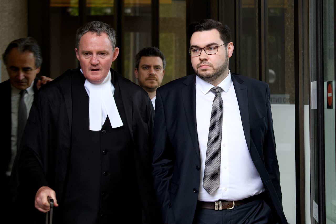 Three men in official suits and the judge