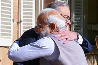 Anthony Albanese embracing Narendra Modi.