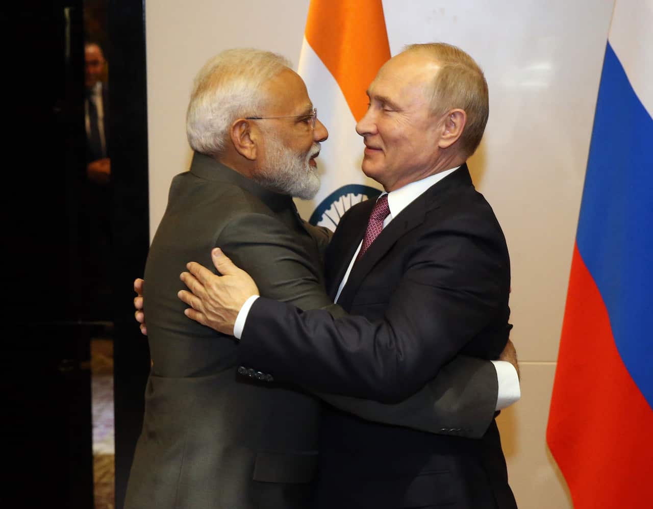 Indian Prime Minister Narendra Modhi (left) and Russian President Vladimir Putin embrace. 