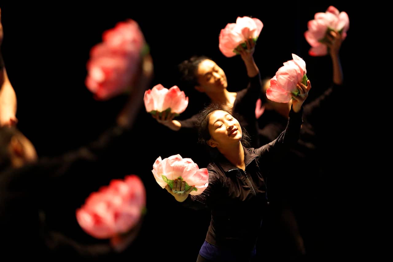 Women performing on stage.
