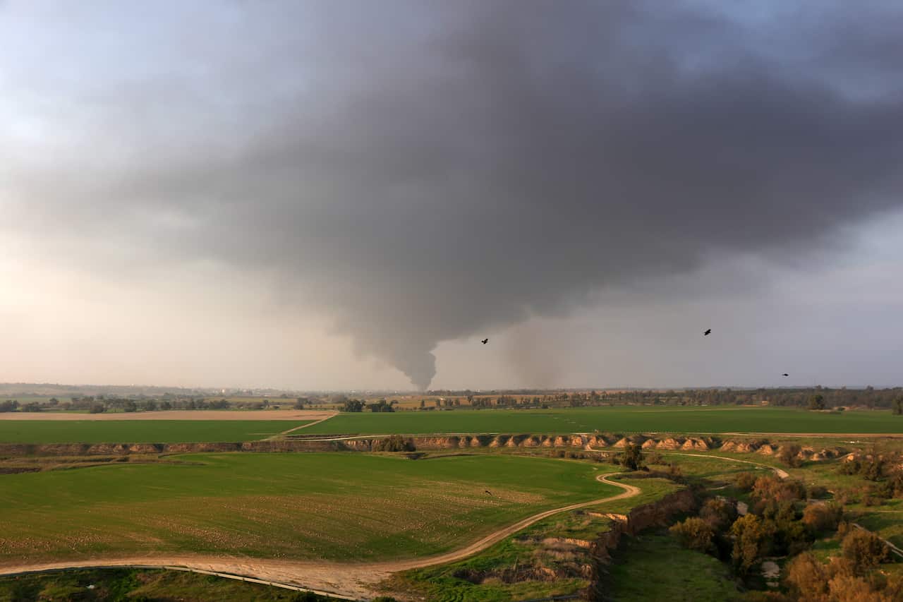 Smoke rises from the Gaza Strip as seen from an area near the border in southern Israel.