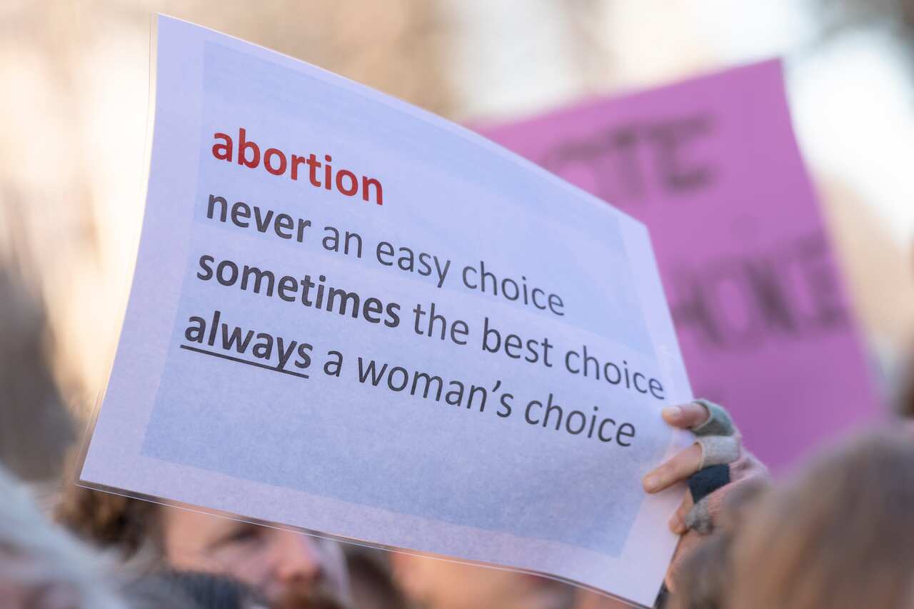 Signs at a rally in favour of decriminalising abortion in NSW.
