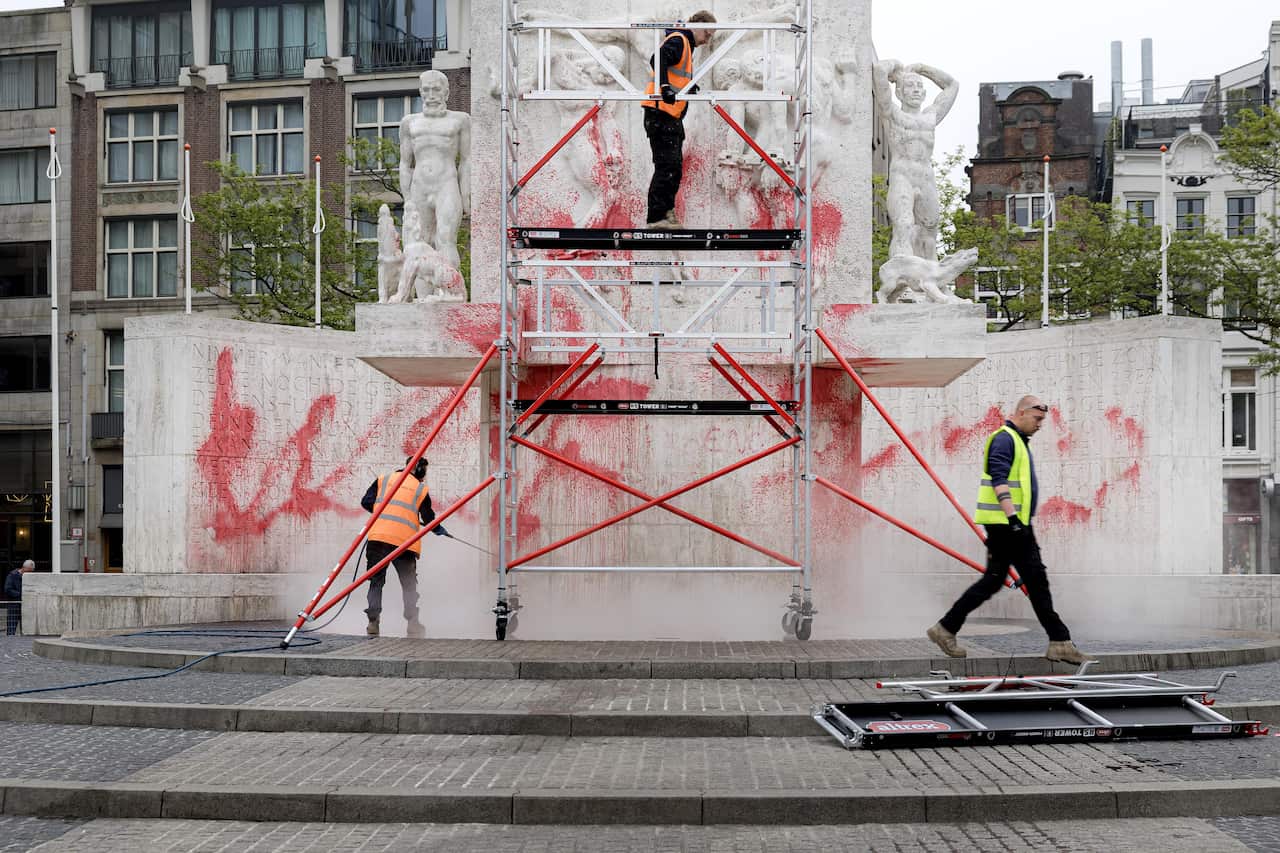 Monument on Dam Square in Amsterdam defaced with red paint