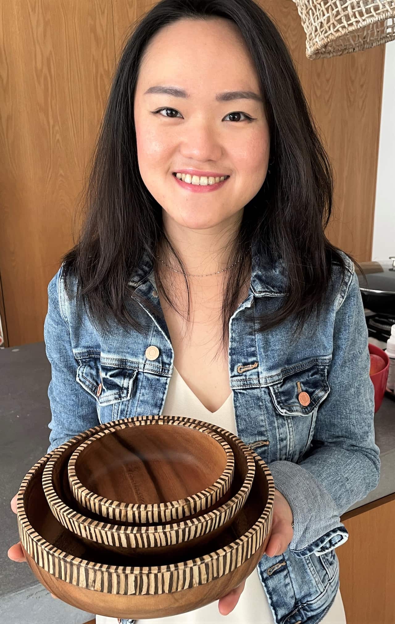 Ira Puspita holding handmade bowls.