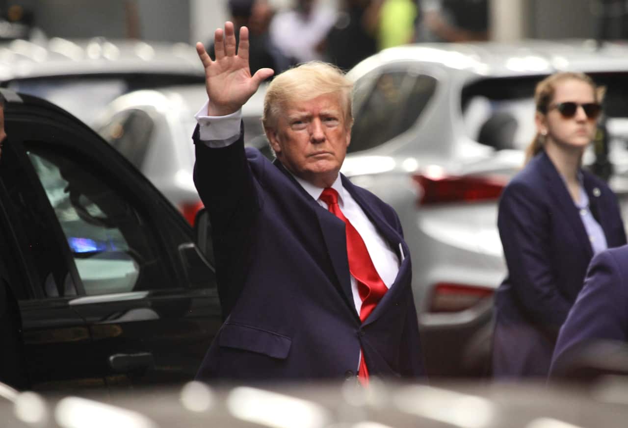 Donald Trump leaves Trump Tower