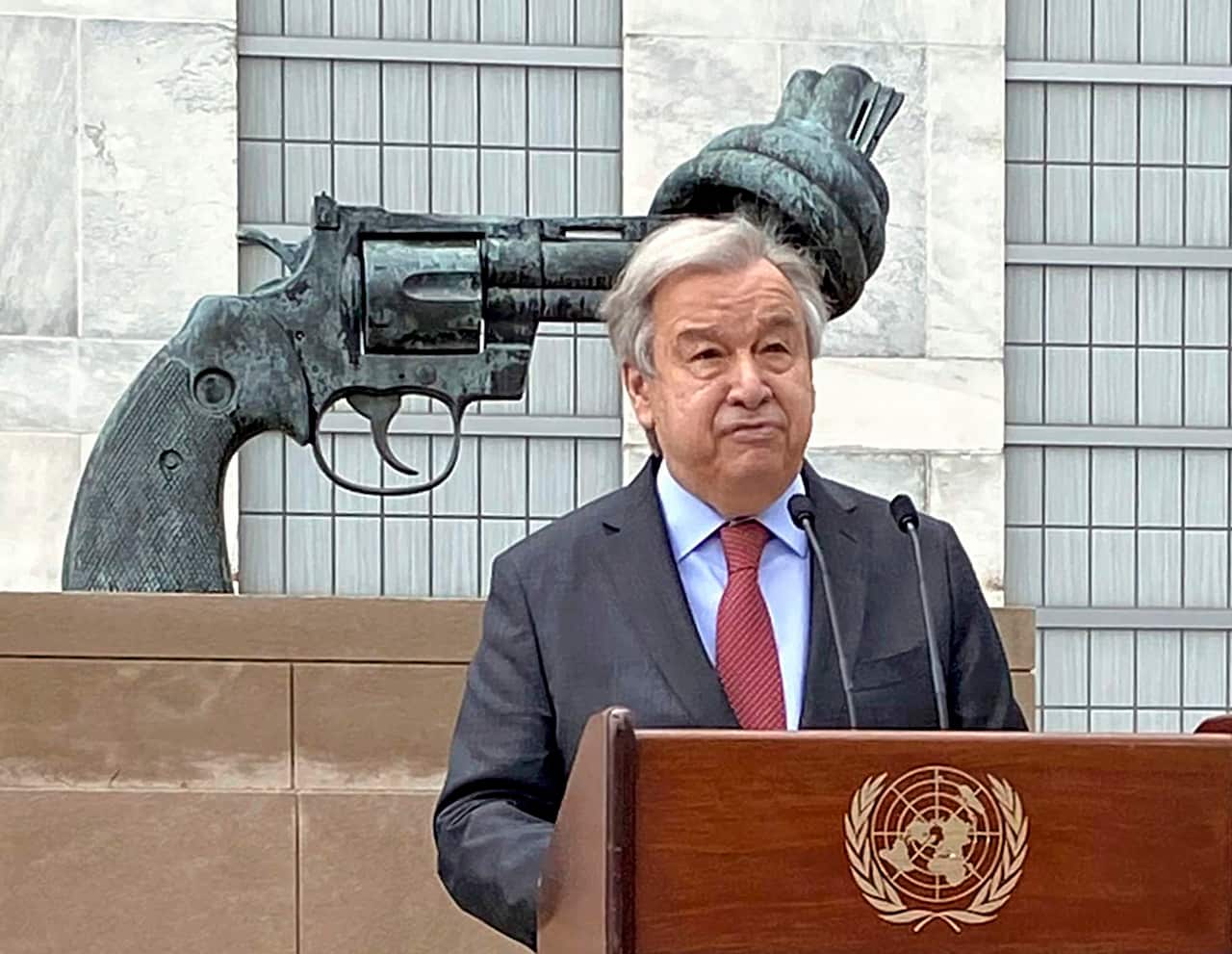 A man standing at a lectern.