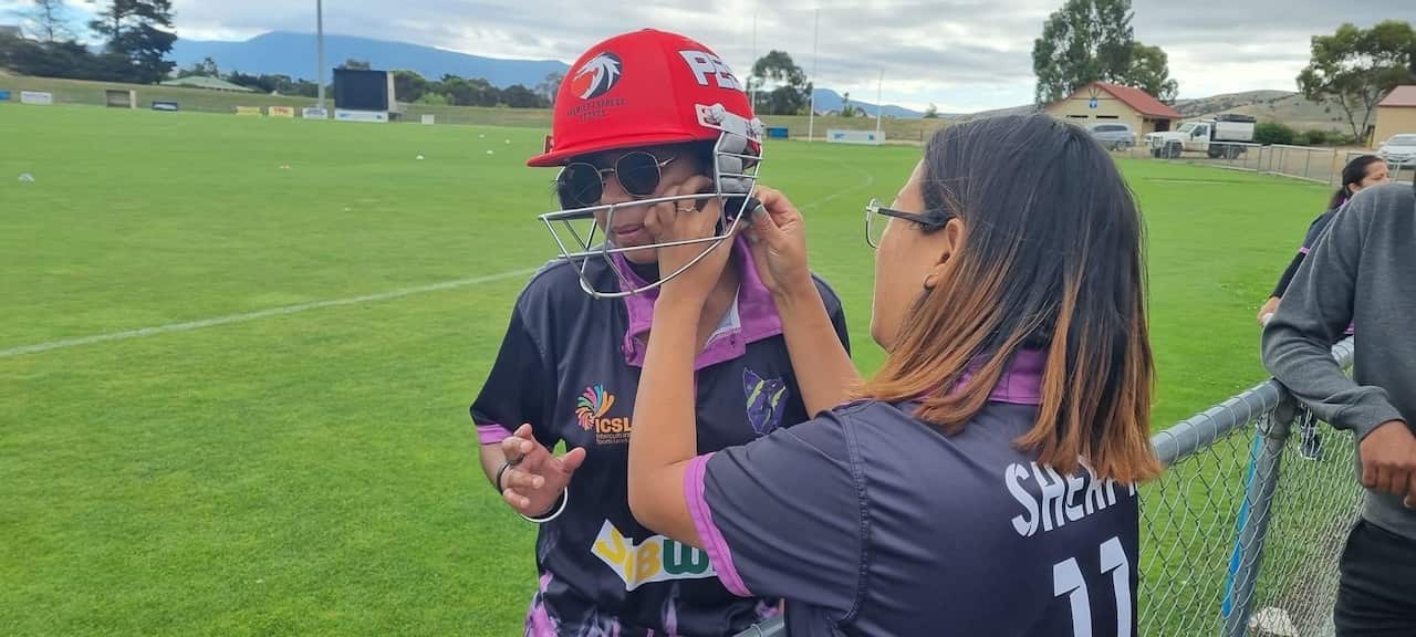 Photo of Yangi Sherpa with her Tassie Superstars.