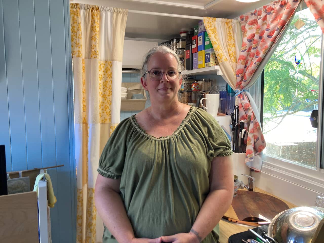 A lady inside her tiny house