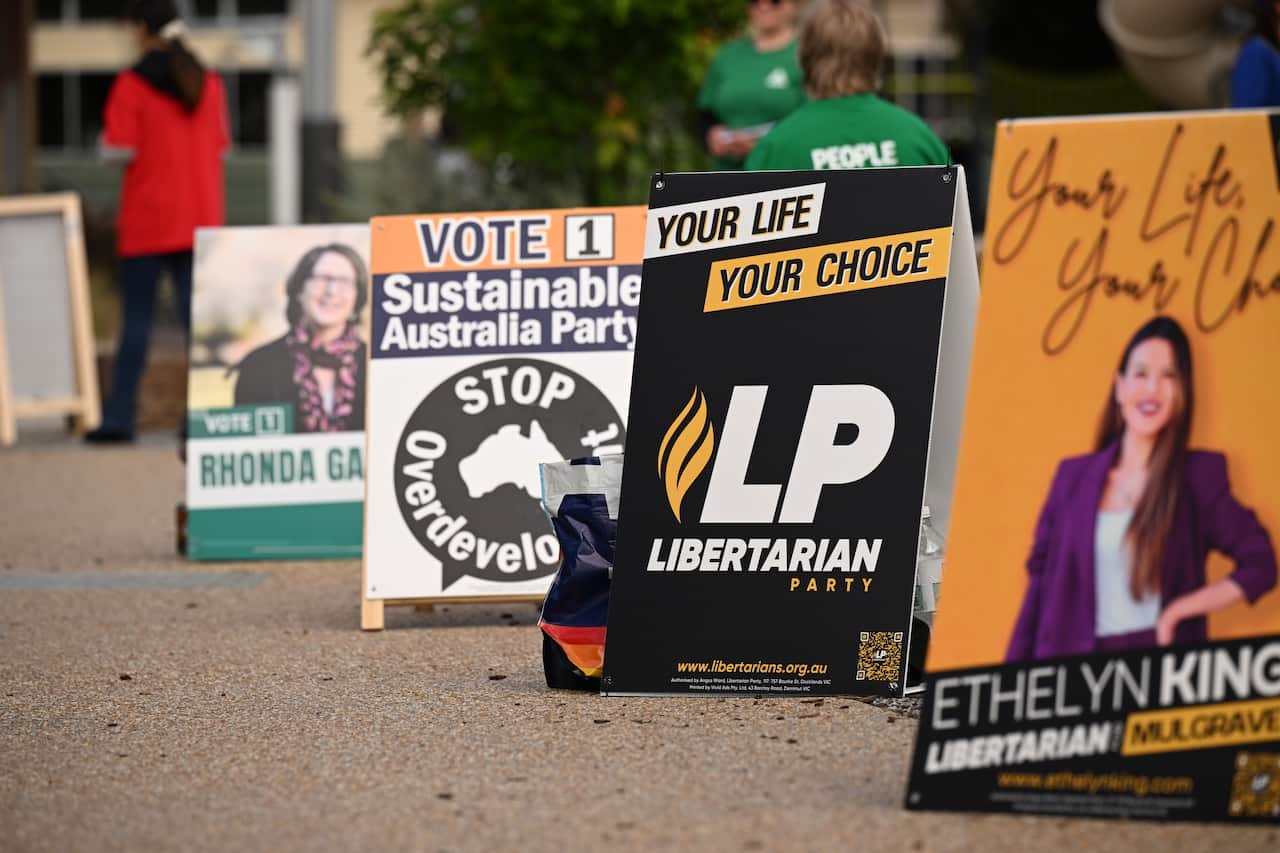 The signs of the different political parties are placed alongside the pathway.