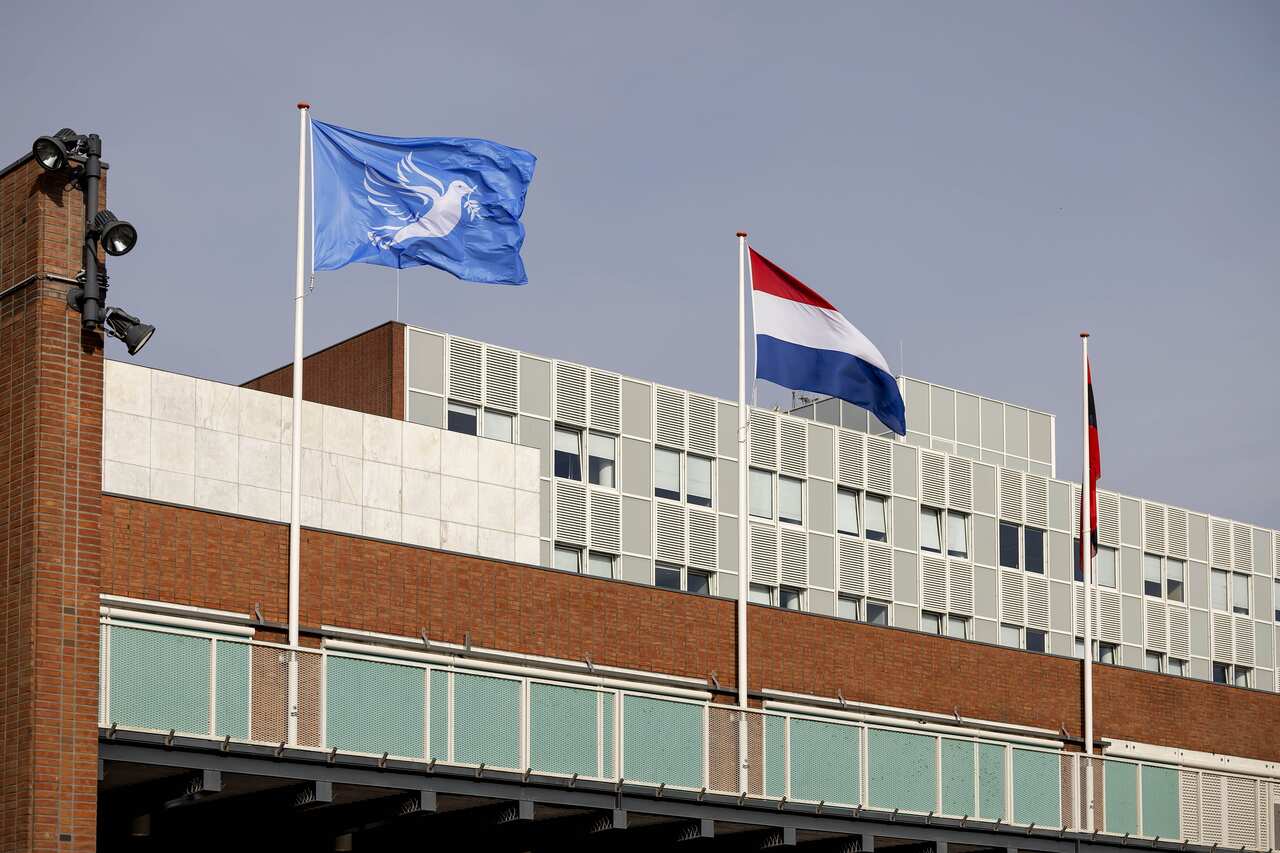 The municipality of Amsterdam raises a flag of peace over violence in the Middle East