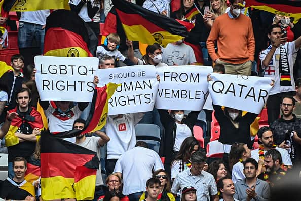 German fans hold up placards at a match