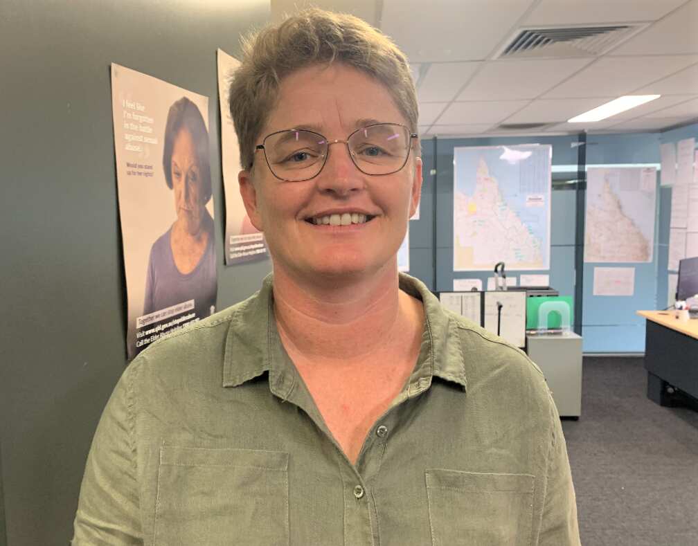 A woman smiling at the camera.