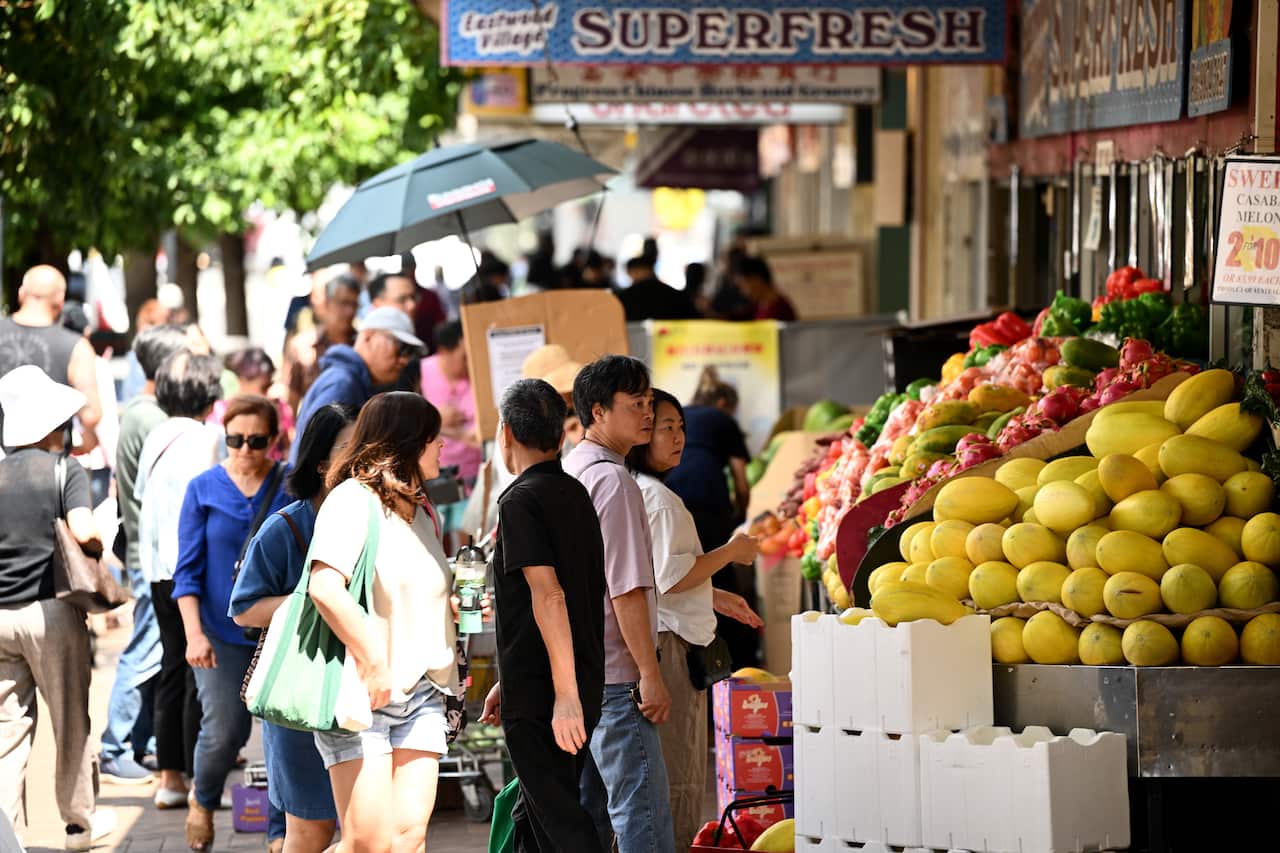 People on the street and shopping for groceries.